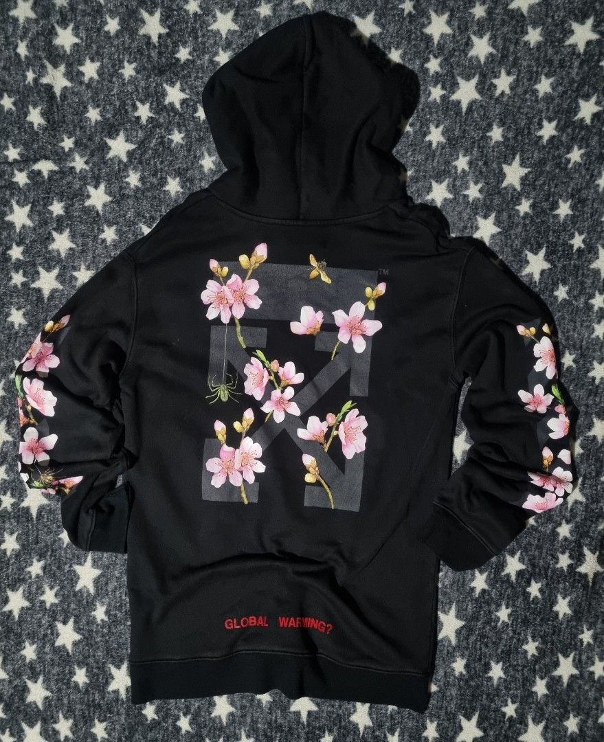 OFF-WHITE "Global Warming?" Cherry Blossom Hoodie (Category: Hoodies) located in Manila. Submitted by ja_thrift. (Listing ID 1461241434, Image 2). Description: - Authentic Black OFF-WHITE Hoodie - Features striking cherry blossom graphics on sleeves and back - 'Global Warming?' text prominently displayed on the front hem - Iconic 'OFF' logo on the chest - Tag details: 'MAIN LABEL' and '2015' collection.