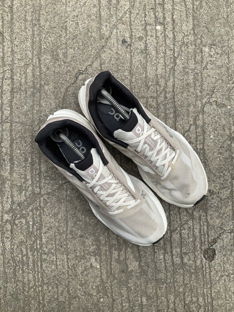 On Running Cloud Next "Swiss Engineering" Shoes (Category: Sneakers) located in Cavite. Submitted by thriftkicks3 (Listing ID 1461270463, Image 3). Description: - Grey and white On Running CloudNext performance running shoes. - "Swiss Engineering" printed on the side. - Unique sole design for optimal performance. - Versatile: Great for running or everyday wear. - Comes with complimentary shoe trees..
