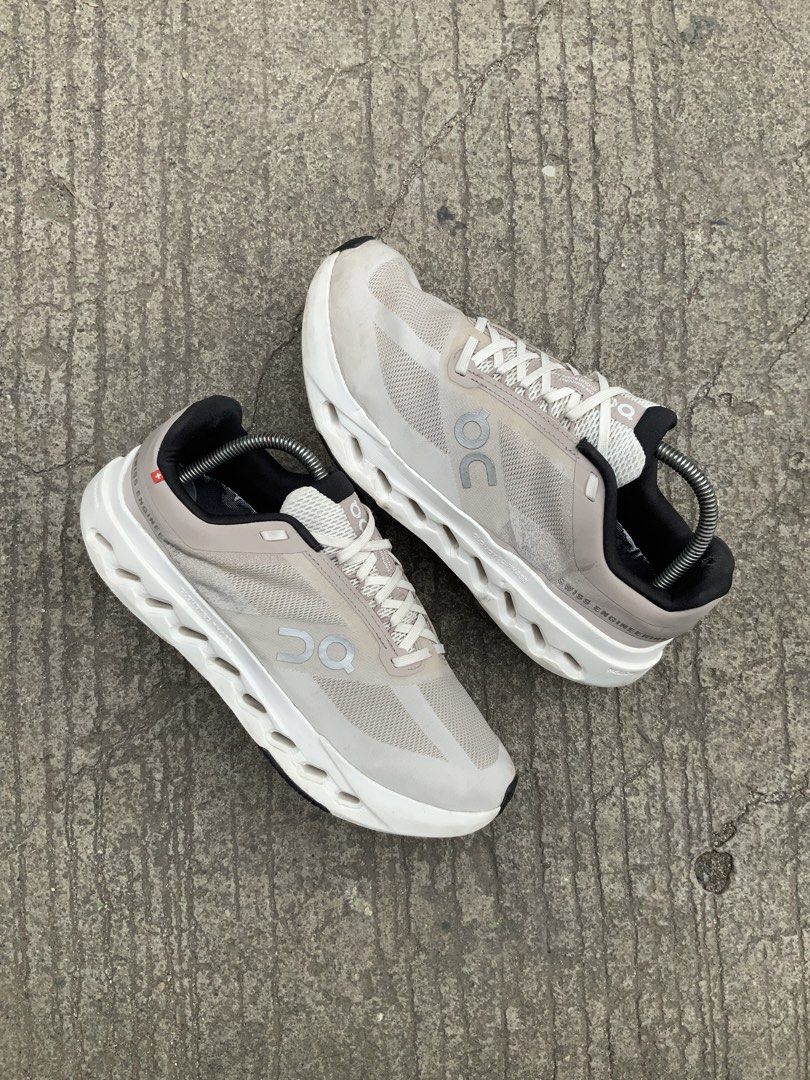On Running Cloud Next "Swiss Engineering" Shoes (Category: Sneakers) located in Cavite. Submitted by thriftkicks3 (Listing ID 1461270463, Image 2). Description: - Grey and white On Running CloudNext performance running shoes. - "Swiss Engineering" printed on the side. - Unique sole design for optimal performance. - Versatile: Great for running or everyday wear. - Comes with complimentary shoe trees..
