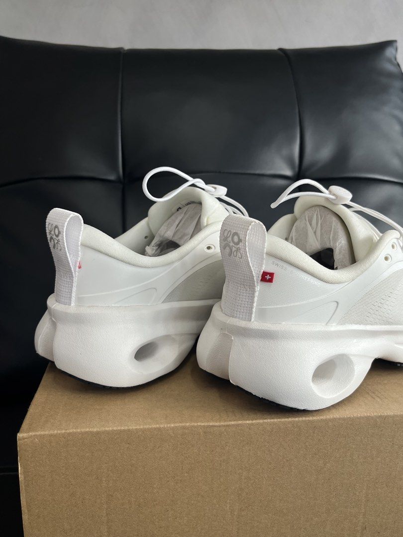 ON x LOEWE CLOUDSOLO SNEAKER (Category: Sneakers & Footwear) located in San Fernando. Submitted by archivalhighlights (Listing ID 1461241901, Image 3). Description: ON x LOEWE CLOUDSOLO SNEAKER White colorway Size:41 Inclusion:Box,extra laces logo detail pull tab lace-up fastening perforated detailing ridged rubber sole Composition Outer: Fabric 100% Lining: Fabric 100% Sole: Rubber 100%.