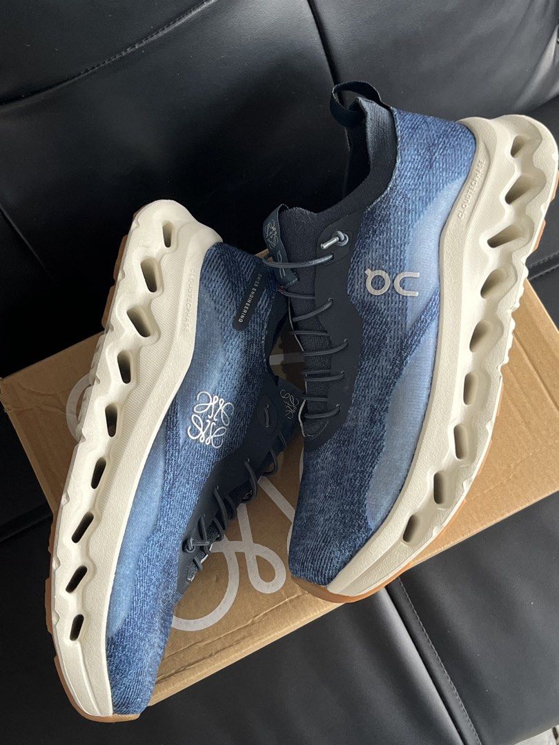 ON x LOEWE CLOUDTILT SNEAKER (Category: Sneakers & Footwear) located in San Fernando. Submitted by archivalhighlights (Listing ID 1461242603, Image 3). Description: ON x LOEWE CLOUDTILT SNEAKER Denim Blue /WHITE Size:40 Inclusion:Box,Laces logo detail pull-tab at the heel lace-up fastening rubber sole cloudtec phase sole Composition Outer: Recycled Polyester 100%, Thermoplastic Polyurethane (TPU) 100% Lining: Fabric 100% Sole: Rubber 100%.