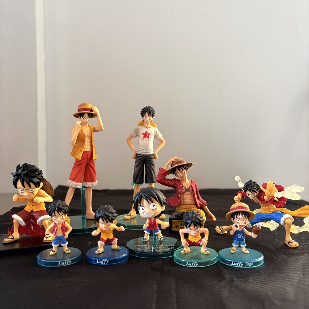 One Piece Luffy Action Figure Set (Category: Figurines & Statues) located in Manila. Submitted by tj.merch (Listing ID 1461262475, Image 1). Description: - Collection of One Piece Monkey D. Luffy figures - Features various poses and outfits - Ideal for any anime fan - Each figure comes with an individual stand - Some figures include clear bases with 'Luffy' or 'Luffy Jage' text - Perfect for display or adding to your collection.
