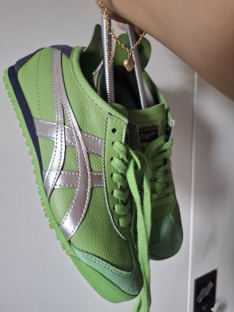 Onitsuka Tiger Mexico 66 Green Silver (Category: Sneakers) located in Marikina City. Submitted by bags21.ph (Listing ID 1461291593, Image 3). Description: - Authentic Onitsuka Tiger Mexico 66 sneakers - Color: Green with silver stripes - Material: Suede and leather upper - Laces: Green - Style: Classic, versatile for everyday wear - Features: Comfortable and stylish.