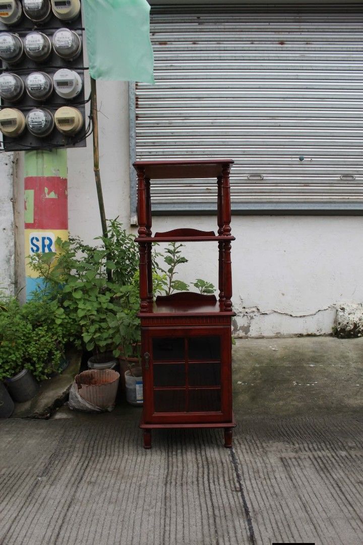 Open Shelves (Category: Shelves, Cabinets & Racks) located in Meycauayan. Submitted by marygracecasimiro (Listing ID 1461224302, Image 1). Description: Vintage Wooden Storage Cabinet Three open shelves, decorative spindle posts and a lower cabinet for concealed storage. Perfect as a telephone stand, plant stand, bookshelf or display cabinet L:15 ¾ • W:15 ¼ • H:46 ¼ inches 5,400 pesos only🩷.