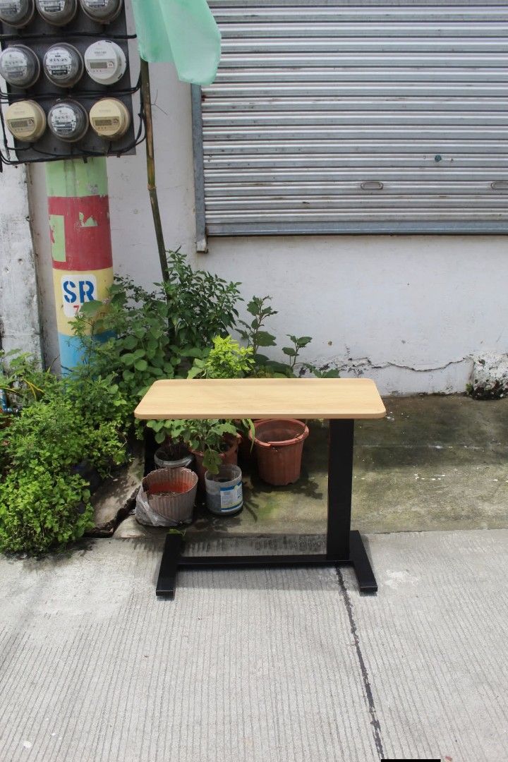 Overbed Table (Category: Tables & Sets) located in Meycauayan. Submitted by marygracecasimiro (Listing ID 1461225470, Image 2). Description: Adjustable Mobile Overbed Table Adjustable mobile overbed table with a height-adjustable column, spacious wood-grain tabletop and smooth-rolling caster base. Perfect for use as a bedside table, laptop desk, reading table or work surface L:31 ½ • W:15 ¾ • H:26 up to 37 ½ inches 3,500 pesos only🧡.