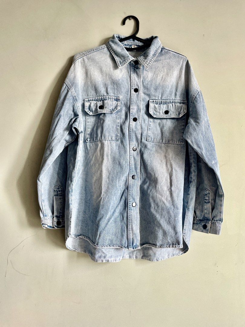 Oversized Acid Wash Denim Shirt Jacket (Category: Coats, Jackets and Outerwear) located in Makati City. Submitted by ecrumnl (Listing ID 1461324016, Image 1). Description: - Cool oversized denim shirt - Acid wash for a vintage look - Two chest pockets with button closures - Button-up front - Versatile: wear open or closed - Perfect for layering.