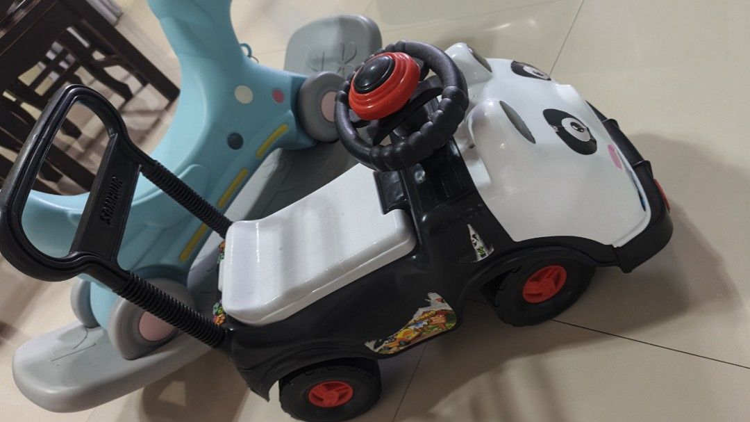 Panda Ride-On Push Car with Handle (Category: Kids Toys) located in Valenzuela. Submitted by ataraonlineshop (Listing ID 1461193293, Image 2). Description: - Adorable panda ride-on car perfect for toddlers. - Includes a parent push handle for easy guidance. - Fun steering wheel with sound effects to entertain your child. - Convenient storage compartment under the seat for toys. - Suitable for both indoor and outdoor adventures. - Designed for eas