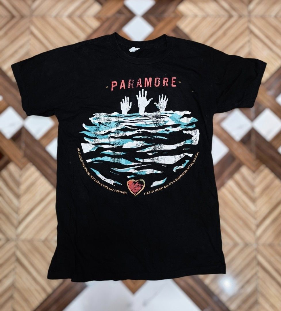 Paramore 2000s shirt (Category: Tshirts & Polo Shirts ) located in Digos. Submitted by emmanuel28 (Listing ID 1461124099, Image 1). Description: PARAMORE shirt by Startee Y2K era Dimes: 18.5 x 25 in good condition Issue may white spots. Black na black pa sana color rate 9.5/10 Buyer shoulders shipping fee.
