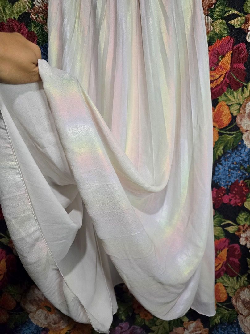 Pastel Iridescent Striped Maxi Skirt (Category: Skirts) located in Paranaque City. Submitted by titaartestudio (Listing ID 1461244620, Image 3). Description: - Flowy pastel striped maxi skirt - Comfortable elastic waistband fits 24-33 inches - Length: 33 inches - Lightweight material, perfect for warm weather - Versatile for casual or dressed-up occasions.