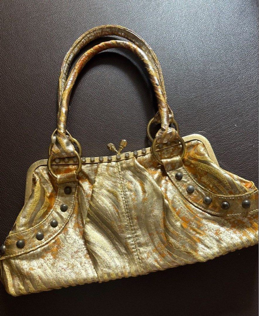 Pegaso Milano Gold Y2K bag (Category: Shoulder Bags) located in Quezon City. Submitted by skinnyshopaholic (Listing ID 1461231538, Image 1). Description: Measures approximately 12 inches wide and 7 inches tall. Can fit iPhone pro max. Decluttering!.