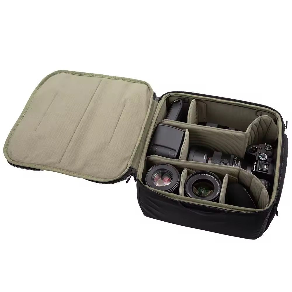 PGYTECH Camera Insert (Medium) (Category: Camera Bags & Carriers) located in Singapore. Submitted by boying.jurolan (Listing ID 1461156855, Image 2). Description: - Black camera bag - Adjustable dividers - Fits camera body, lenses, and accessories - Wear as crossbody or shoulder bag - Durable material - Plenty of space for gear - Ideal for photographers on the go Specs: Compatibility | For regular DSLR and mirrorless cameras: Two cameras+four len