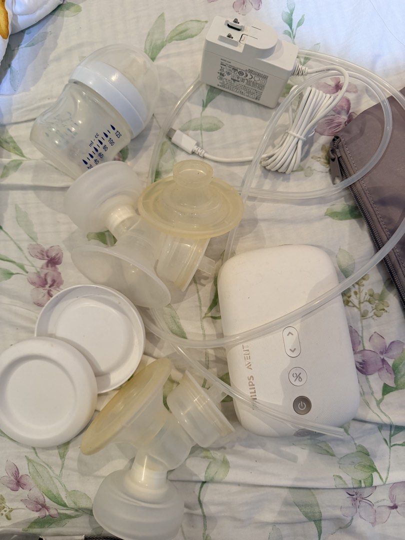 Philips Avent Electric Breast Pump with Bag (Category: Breastfeeding & Bottle Feeding) located in Cebu City. Submitted by cutexoxoshop (Listing ID 1461311400, Image 3). Description: - Philips Avent electric breast pump set - Includes pump, bottles, flanges, and power adapter - Comes with a grey storage bag - Ideal for convenient pumping on the go - All parts are shown in the photos.