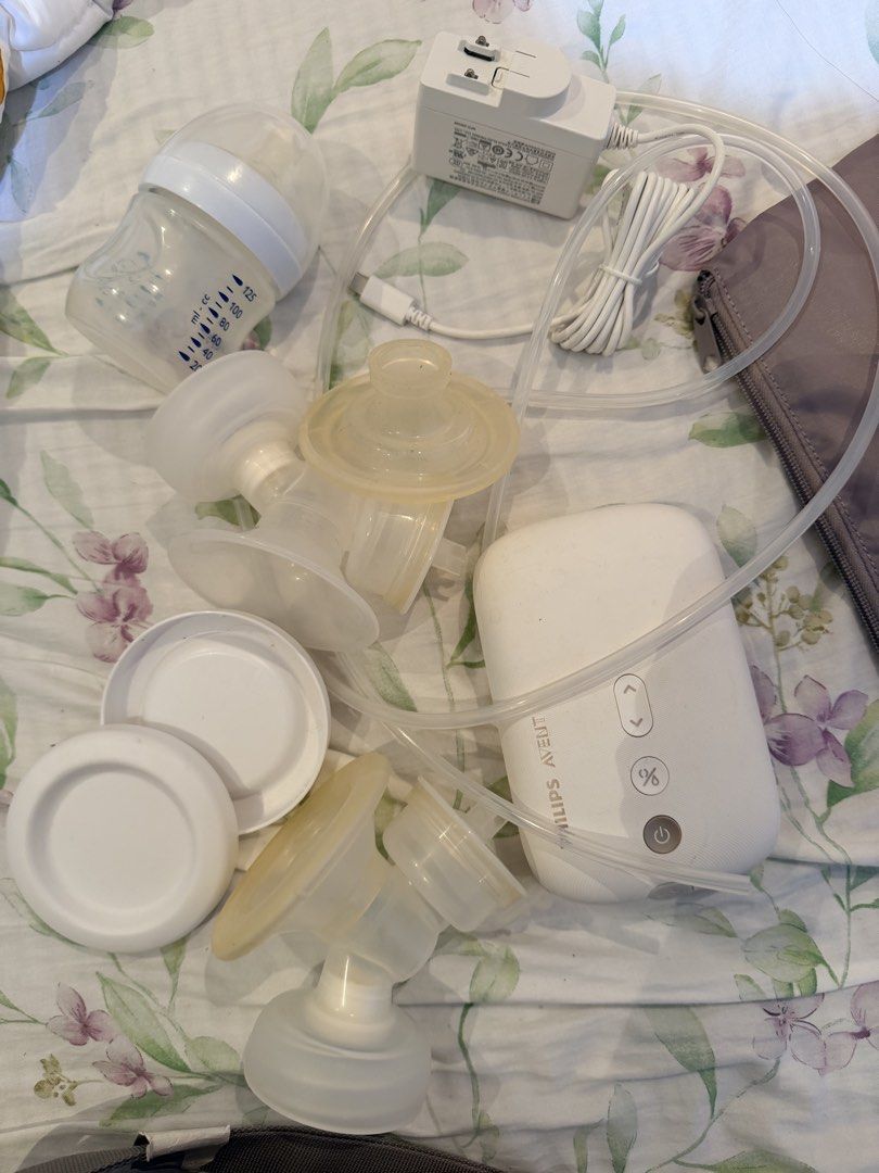 Philips Avent Electric Breast Pump with Bag (Category: Breastfeeding & Bottle Feeding) located in Cebu City. Submitted by cutexoxoshop (Listing ID 1461311400, Image 2). Description: - Philips Avent electric breast pump set - Includes pump, bottles, flanges, and power adapter - Comes with a grey storage bag - Ideal for convenient pumping on the go - All parts are shown in the photos.