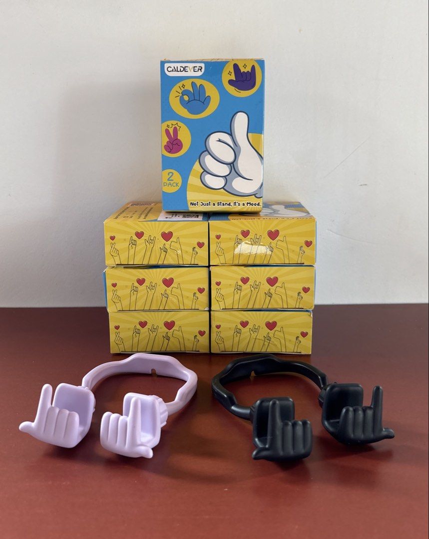 Phone & Tablet Stand “Mood Moves Series — CALDEVER” (sealed) (Category: Mounts & Holders) located in Cavite. Submitted by nanangonlineshop (Listing ID 1461117685, Image 3). Description: 📌 Phone & Tablet Stand “Mood Moves Series — CALDEVER” (sealed) 🏷️ P25 (1 pc. per pack) 🏷️ P50 (2 pcs. per pack) ✅ Design Concept: Flexible hand-gesture shapes (such as the “Thumbs Up”, “Peace Sign/Yeah Vibe”, and “Rock On” gestures) that wrap around your device