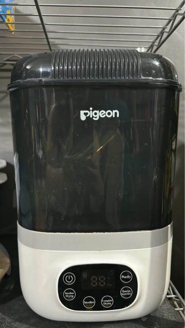 Pigeon Sterilizer and Dryer (Category: Breastfeeding & Bottle Feeding) located in Manila. Submitted by micsevang59553 (Listing ID 1461223077, Image 1). Description: - Pigeon Sterilizer and Dryer - Functions: Sterilize, Dry, Purify - Digital display shows remaining time - Ideal for baby bottles, pacifiers, and other baby essentials - Multiple easy-to-use settings - Ensures baby's items are clean and safe.
