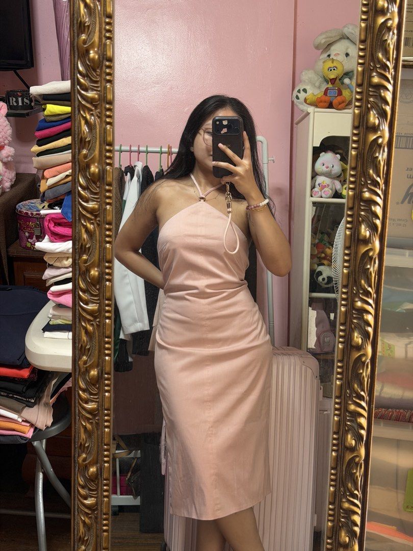 Pink Halter Neck Midi Dress (Category: Dresses) located in Manila. Submitted by mongosoleigh (Listing ID 1461261821, Image 1). Description: - Cute pink midi dress - Halter neck design - Subtle checkered pattern - Side tie detail for a flattering fit - Ideal for casual outings or dates - Comfortable to wear - Selling because it's not my style anymore.