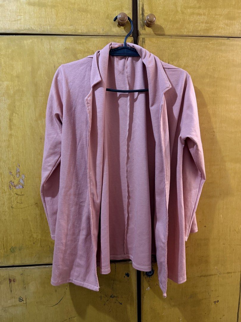 Pink Open Front Cardigan (Category: Coats, Jackets and Outerwear) located in Manila. Submitted by kmiiyyy (Listing ID 1461274064, Image 1). Description: - Light pink open front cardigan - Soft material - Long sleeves - Ideal for layering over tops - Versatile for casual or dressed-up looks - No buttons or closures.