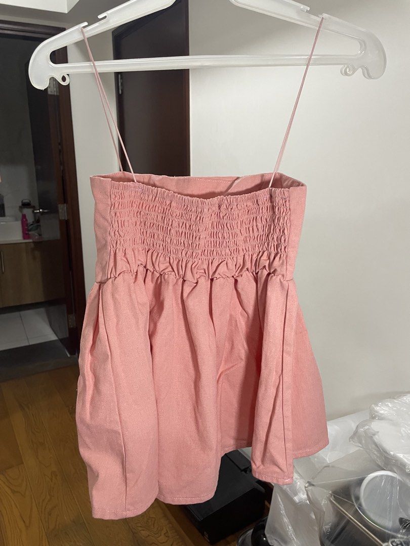 Pink Smocked Camisole Top (Category: Sleeveless) located in Manila. Submitted by ellie_owl (Listing ID 1461223548, Image 1). Description: - Adorable pink camisole top - Features a smocked bodice for a flattering fit - Delicate thin spaghetti straps - Flared hem for a feminine silhouette - Estimated size: Small to Medium (S/M) - Versatile for casual outings or dressing up.
