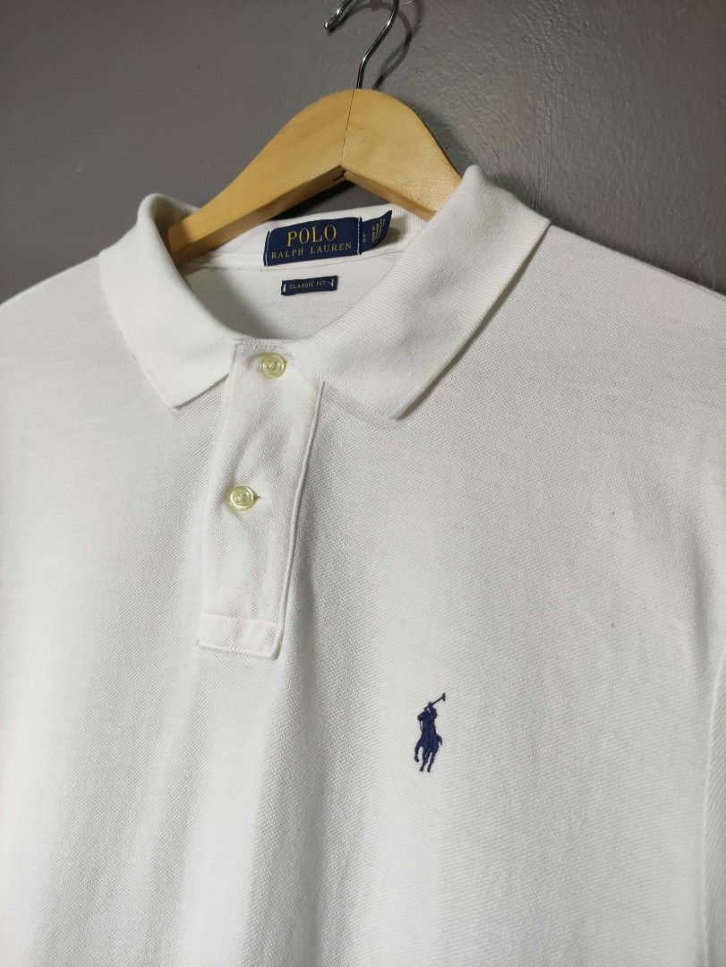 Poll Ralph Lauren polo shirt (Category: Luxury Apparel) located in Batangas. Submitted by andifits.ph (Listing ID 1461295361, Image 2). Description: Polo Ralph Lauren polo shirt - Color: White - Size: L "23 x 30 B32" - Classic fit - Material: 100% cotton - Made in Vietnam - Features the iconic polo player logo - Classic collar and short sleeves - Ideal for a casual and stylish outfit.
