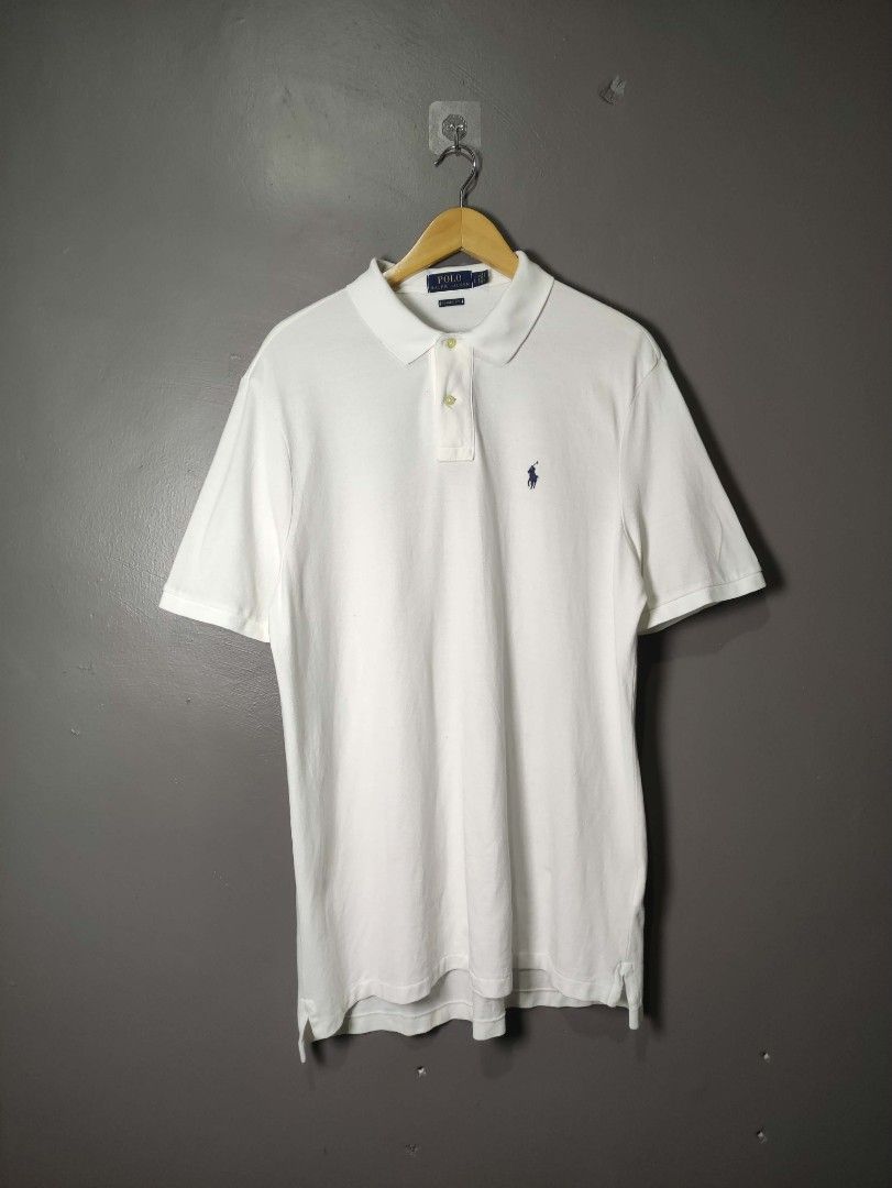 Poll Ralph Lauren polo shirt (Category: Luxury Apparel) located in Batangas. Submitted by andifits.ph (Listing ID 1461295361, Image 1). Description: Polo Ralph Lauren polo shirt - Color: White - Size: L "23 x 30 B32" - Classic fit - Material: 100% cotton - Made in Vietnam - Features the iconic polo player logo - Classic collar and short sleeves - Ideal for a casual and stylish outfit.