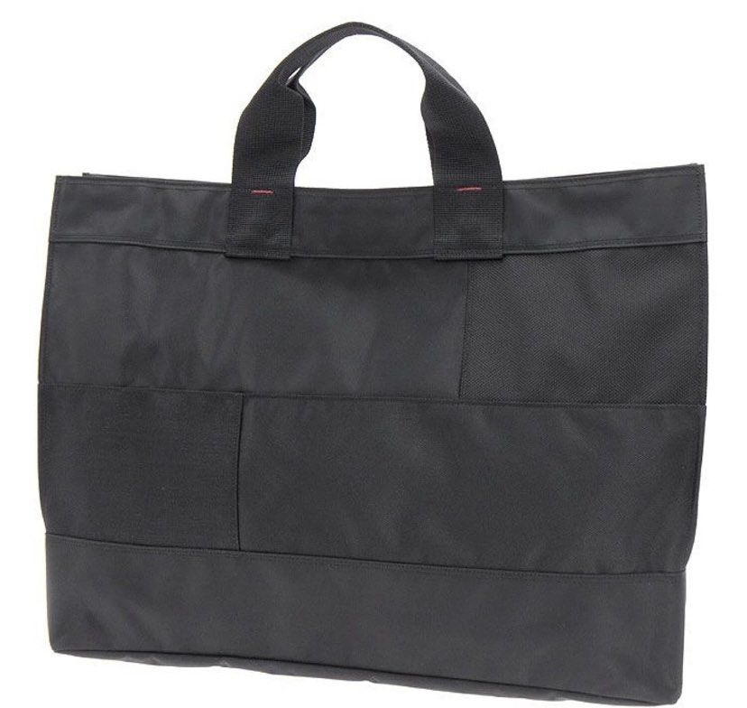 PORTER NETWORK (Category: Luxury Bags & Wallets) located in Lupi. Submitted by shanchalant (Listing ID 1461265433, Image 1). Description: Size: W: 490mm / H: 360mm / D: 140mm This long-selling series features a patchwork of nylon fabrics, including nylon oxford and nylon twill, with different weaves combined together. It consists of business bags and tote bags that are lightweight and affordable. Despite being entirely black, the fabric reveals v
