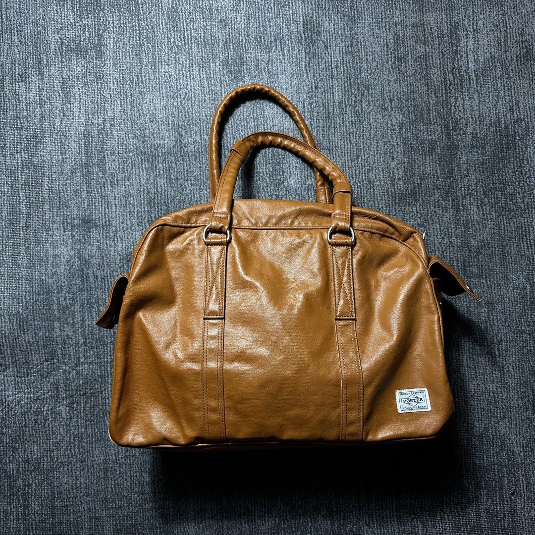 Porter Yoshida & Co. Brown Leather Boston Bag (Category: Luxury Bags & Wallets) located in Manila. Submitted by curatedragss (Listing ID 1461243410, Image 1). Description: - Authentic Porter Yoshida & Co. Tokyo Japan Boston Bag - Rich brown leather - Classic duffel style - Comfortable top handles - Convenient front pocket with snap closures - Secure top zipper closure - Ideal for weekend getaways or as a carry-on luggage.
