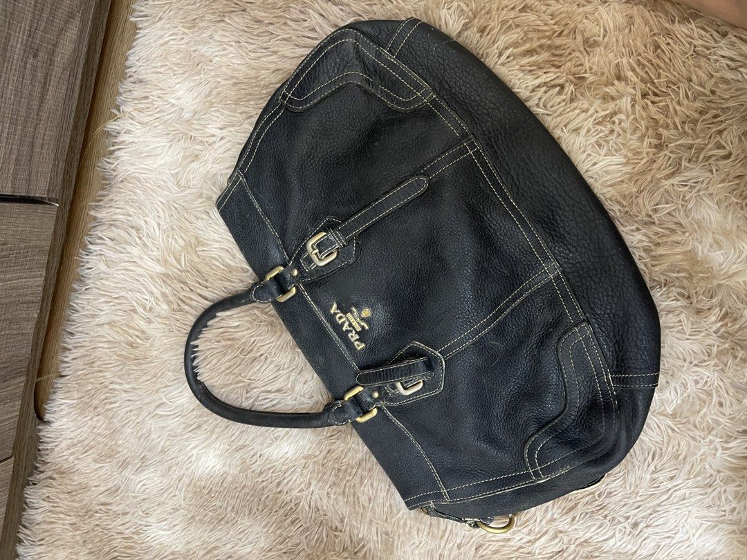 PRADA VINTAGE BAG (Category: Shoulder Bags) located in Concepcion. Submitted by wowsinigangmix (Listing ID 1461260492, Image 2). Description: PRADA LEATHE VINTAGE BAG COLOR NAVY BLUE MEDIUM SIZE WELL-USED SLIGHT FLAWS MANAGE EXPECTATIONS.