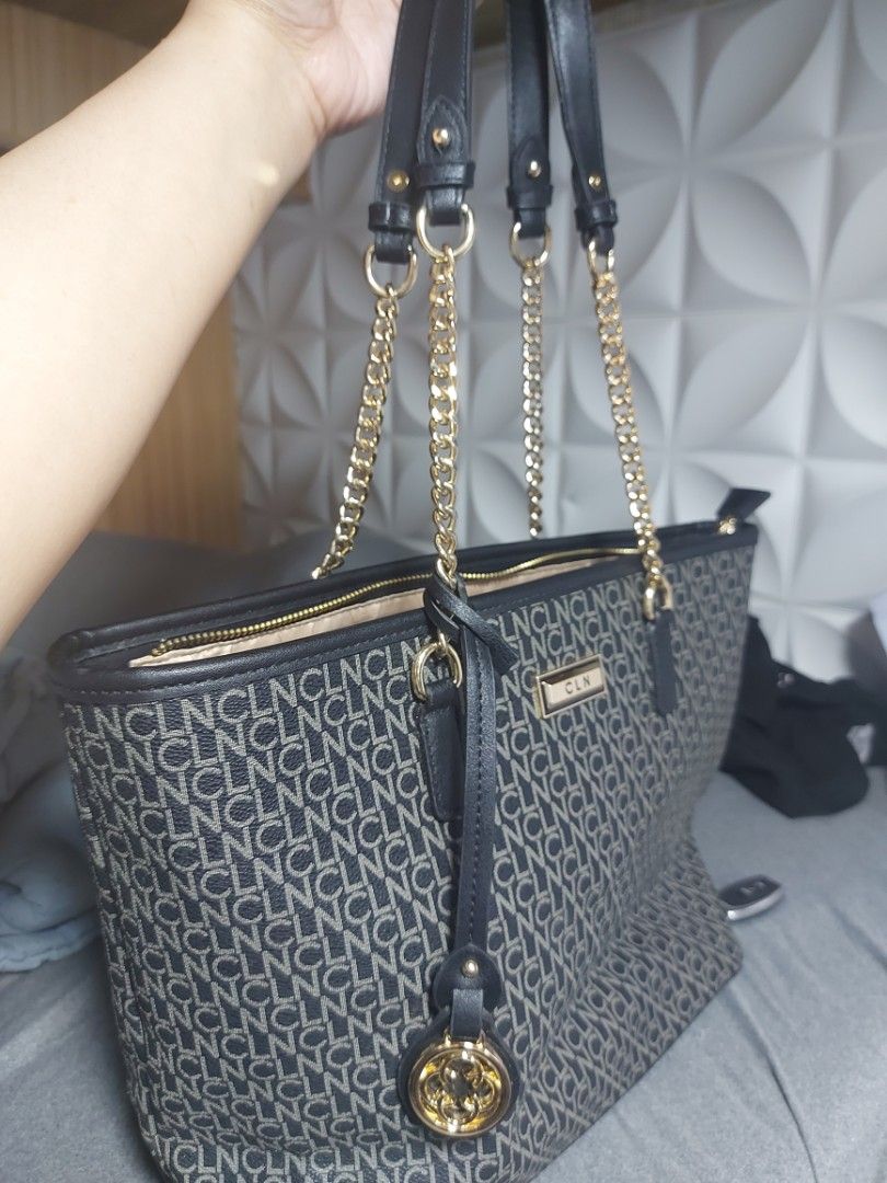 PRELOVED CLN Manogram Tote Bag (Category: Tote Bags) located in Manila. Submitted by ahprilf68208 (Listing ID 1461229932, Image 3). Description: [FOR SALE]PRELOVED CLN manogram tote bag. ➡️Gently used,makinis pa ang canvas at malinis ang interior. ➡️minimal signs of wear lang sa gold hardwear pero makintab parin at presentable. ➡️BLACK/GRAY manogram pattern ➡️w/ front metal nameplate and original CLN circle charm. DM/Pm me po..