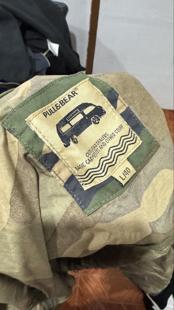 Pull & Bear Camouflage Hooded Jacket L/40 (Category: Coats, Jackets and Outerwear) located in Zamboanga. Submitted by raniee19 (Listing ID 1461243301, Image 3). Description: - Pull & Bear Camouflage Hooded Jacket - Size: L / 40 - Lightweight material, ideal for layering - Features a full zip front and convenient pockets - Versatile for casual wear or outdoor adventures.