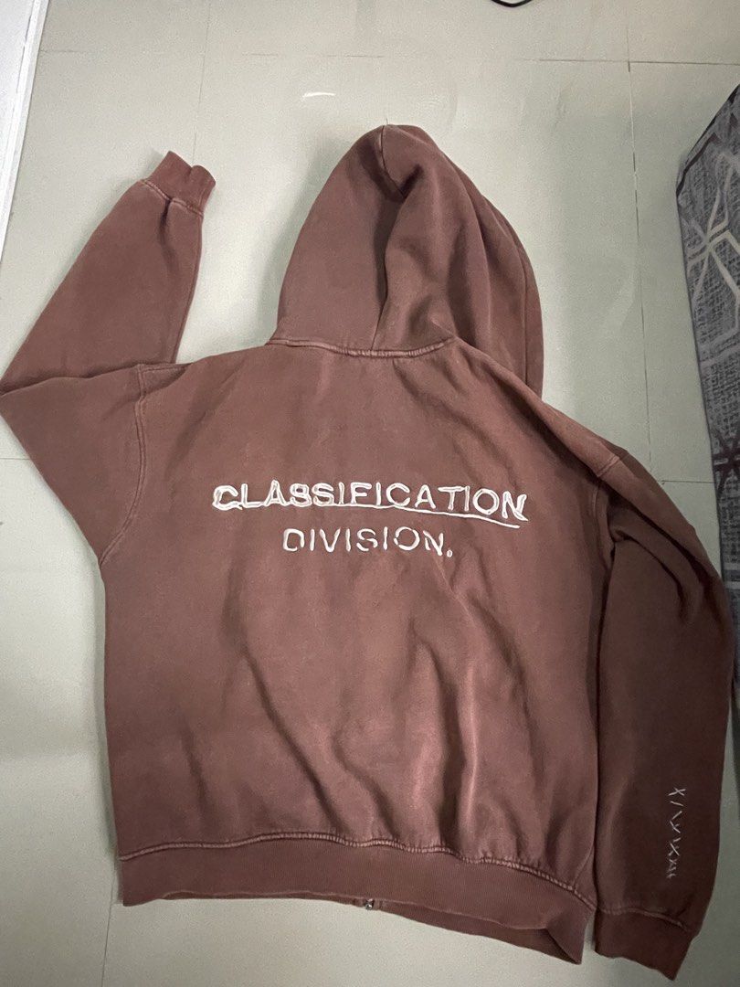Pull&Bear Brown Zip-Up Hoodie (Category: Hoodies) located in Manila. Submitted by seanjcc (Listing ID 1461247570, Image 3). Description: - Brand: Pull&Bear - Color: Brown - Style: Zip-up Hoodie - Features: Fleece-lined interior for extra warmth - Graphic: 'CLASSIFICATION DIVISION.' print on the back - Size: L - Ideal for: Casual wear.