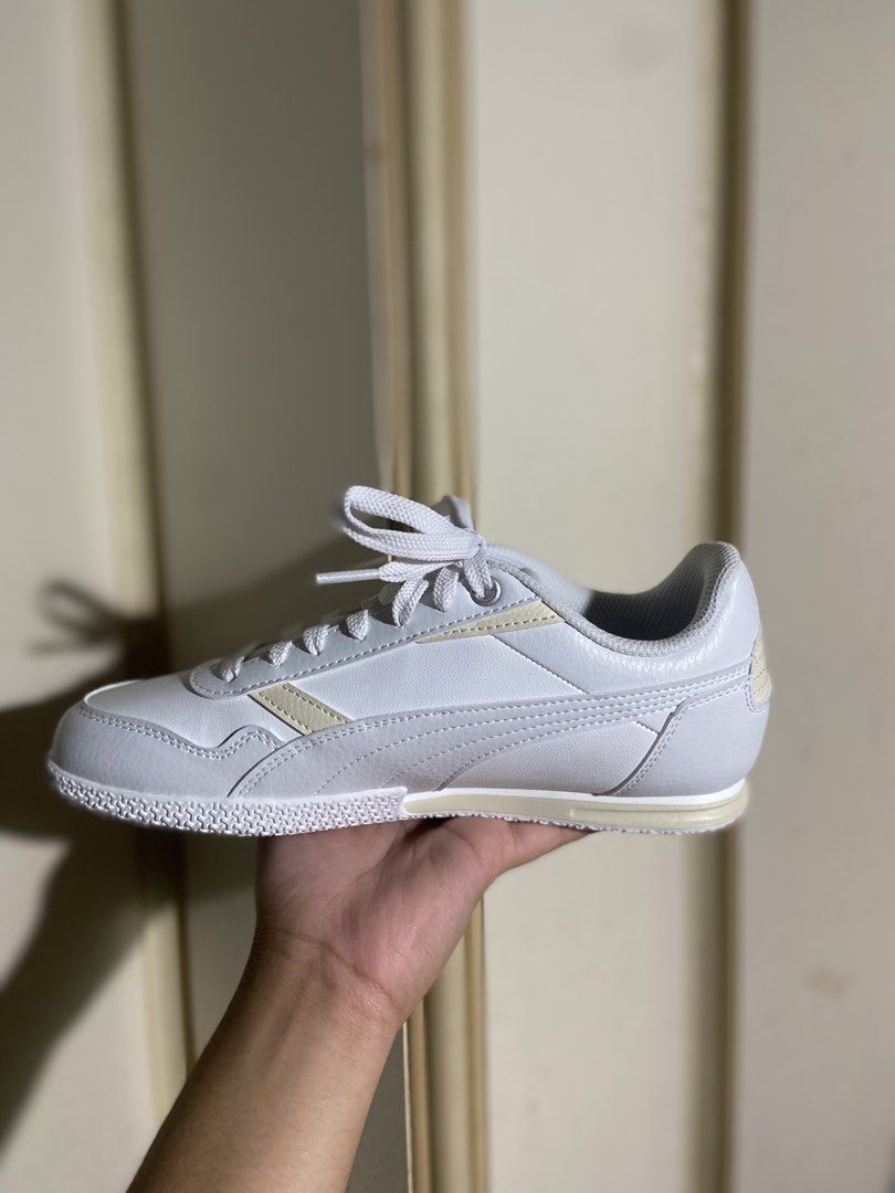 Puma Bella Donna L (Category: Sneakers) located in Manila. Submitted by kyympott (Listing ID 1461231651, Image 2). Description: - Classic white Puma sneakers - Cream accent details - Lace-up closure - Durable sole with Puma logo - Ideal for everyday casual outfits.