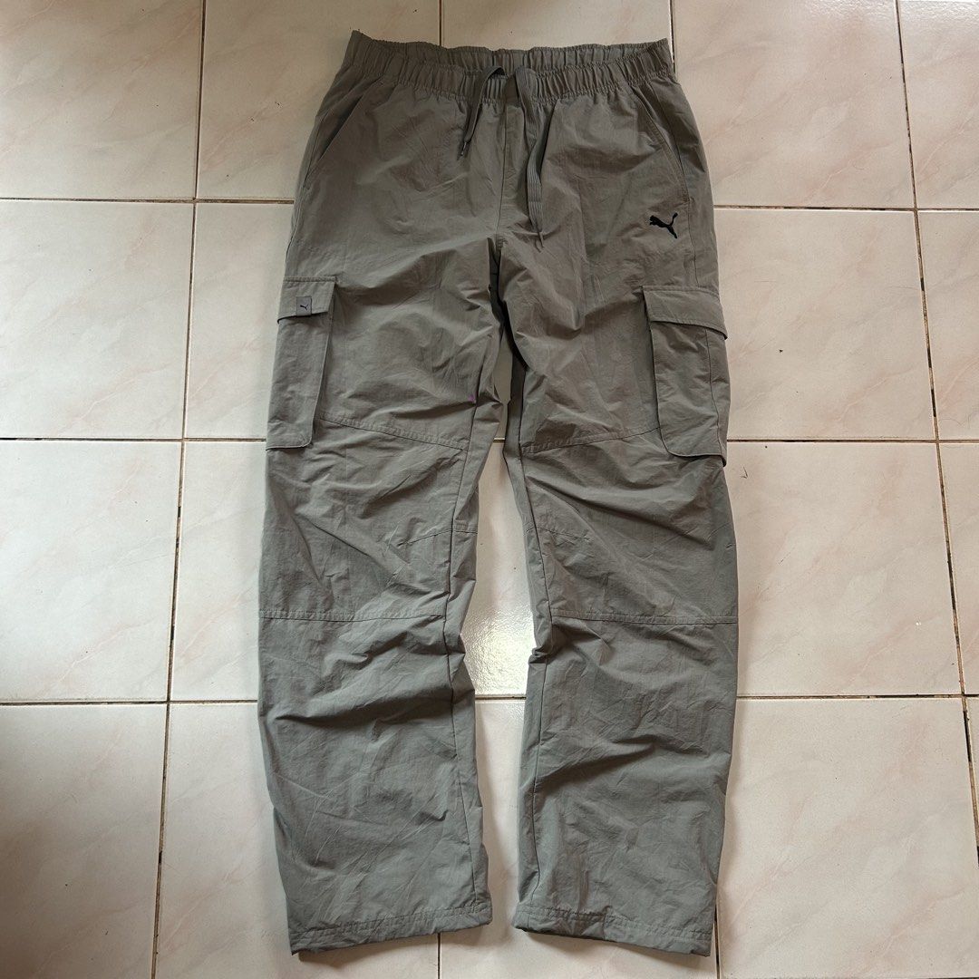 Puma Cargo Pants Grey Asian Size XL🔥 (Category: Other Bottoms) located in Jinoba-an. Submitted by eegiboy (Listing ID 1461153460, Image 2). Description: - Grey Puma cargo pants - Elastic waistband with drawstring - Multiple pockets (front and sides) - Inner mesh lining - Ideal for casual wear or sports activities Wts: Puma Cargo pants 🔥 Nylon 🥵 Size: Large-xl Dimes: 32-36 stretch L-43 Good as new 😍 No issue 😘 700plussf Dm me if interested 📩