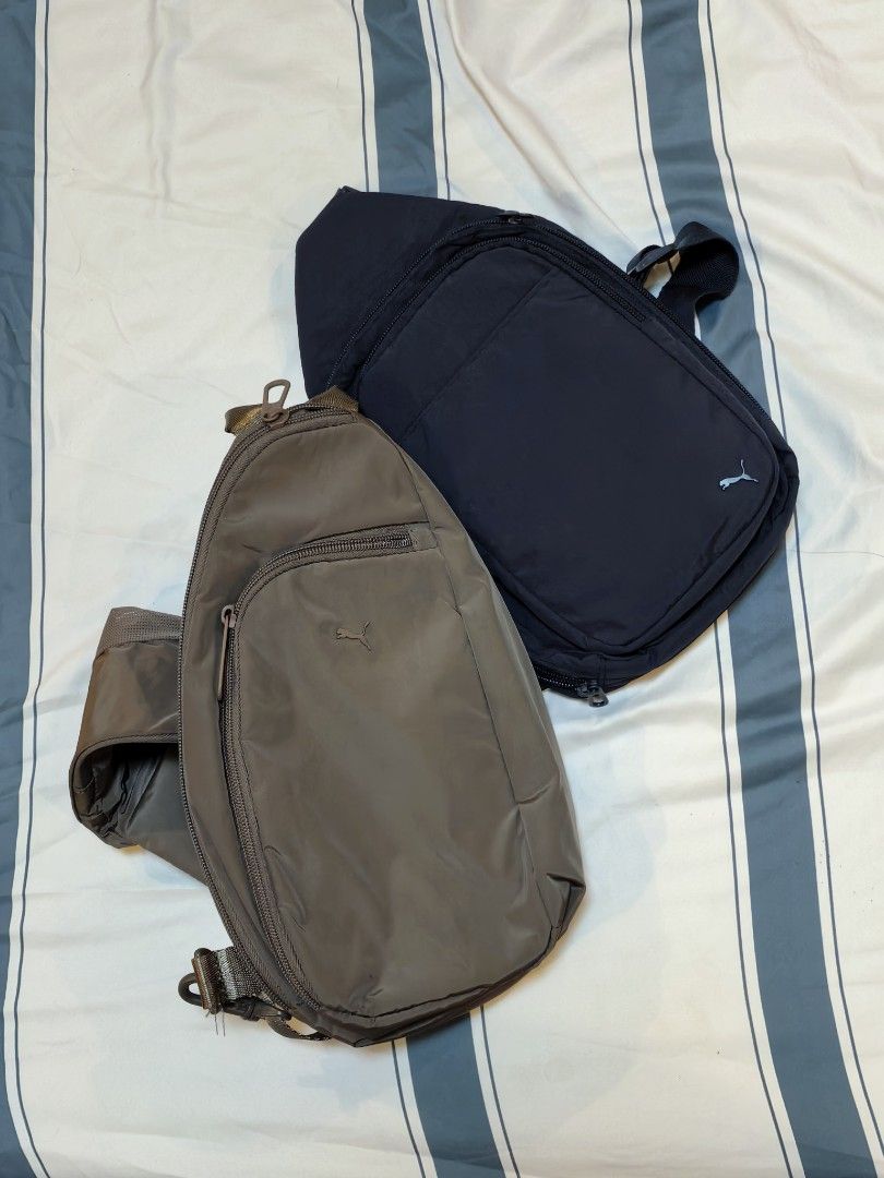 Puma Sling Bags (2 pcs) (Category: Sling Bags) located in Moncada. Submitted by gwatstuffshopaholic (Listing ID 1461258030, Image 1). Description: - Two Puma sling bags available: Navy Blue (Doer) and Brown (Myriad). - Features adjustable straps for a comfortable fit. - Includes secure zippered compartments for your essentials. - Lightweight and practical design. - Perfect for everyday use or travel..
