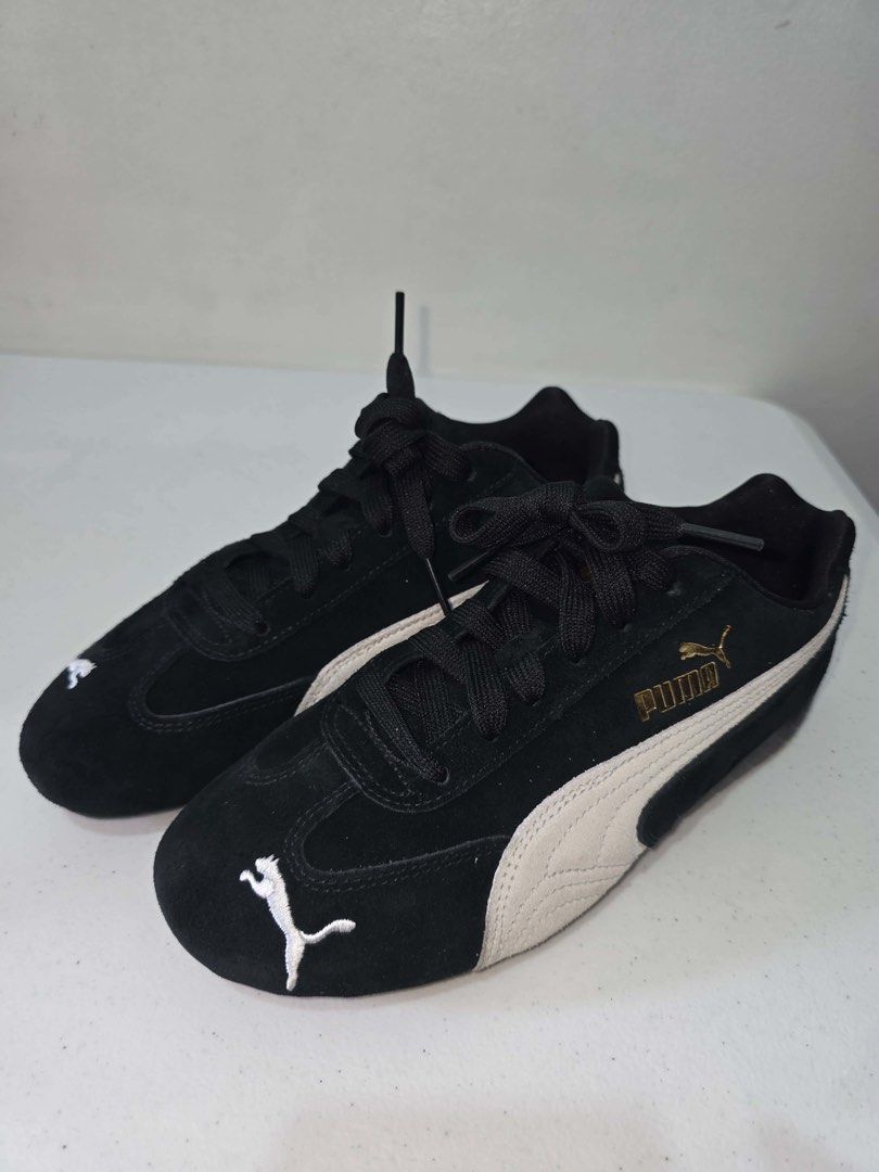 Puma Suede Shoes Black White Gold (Category: Sneakers) located in Manila. Submitted by 1b187415db4d51fa6ebf7ef43cb80c (Listing ID 1461294426, Image 1). Description: - Black Puma suede shoes - White and gold accents - Features Ortholite insoles for superior comfort - Lace-up closure for a secure fit - Ideal for casual outings or driving - Puma logo detail on side and heel.
