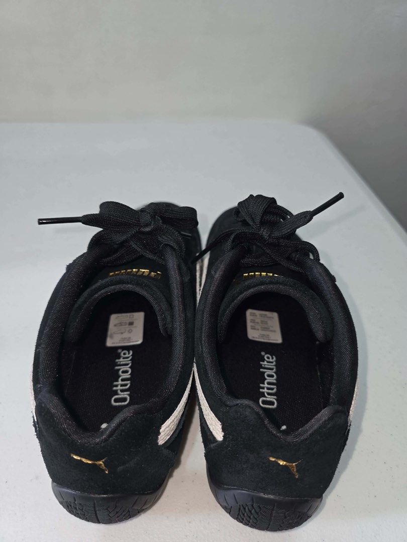 Puma Suede Shoes Black White Gold (Category: Sneakers) located in Manila. Submitted by 1b187415db4d51fa6ebf7ef43cb80c (Listing ID 1461294426, Image 2). Description: - Black Puma suede shoes - White and gold accents - Features Ortholite insoles for superior comfort - Lace-up closure for a secure fit - Ideal for casual outings or driving - Puma logo detail on side and heel.