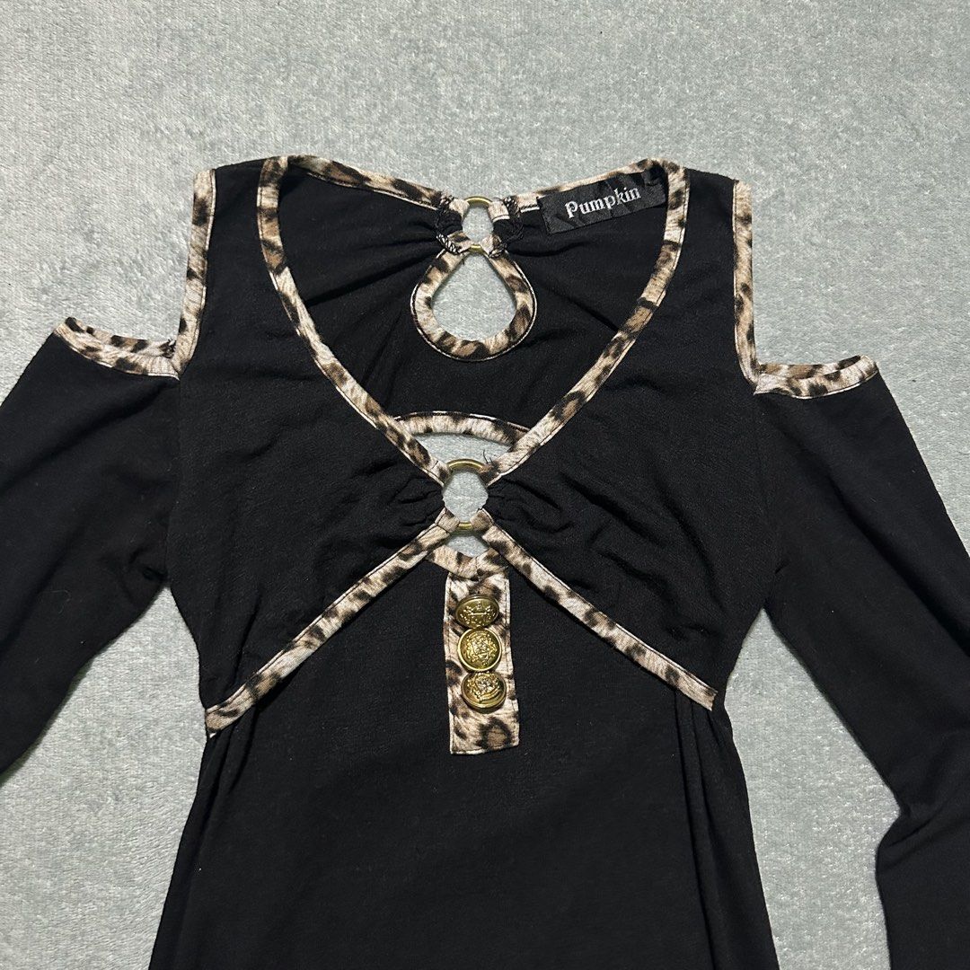 Pumpkin Black Cold Shoulder Leopard Trim Dress (Category: Dresses) located in Bayombong. Submitted by rochelle_archive_garments (Listing ID 1461322590, Image 3). Description: - Elegant black long-sleeved dress - Flattering cold shoulder cutouts - Eye-catching leopard print trim on neckline and cutouts - Front keyhole detail with gold rings and decorative buttons - Comfortable fabric with stretch - Ideal for a stylish night out.