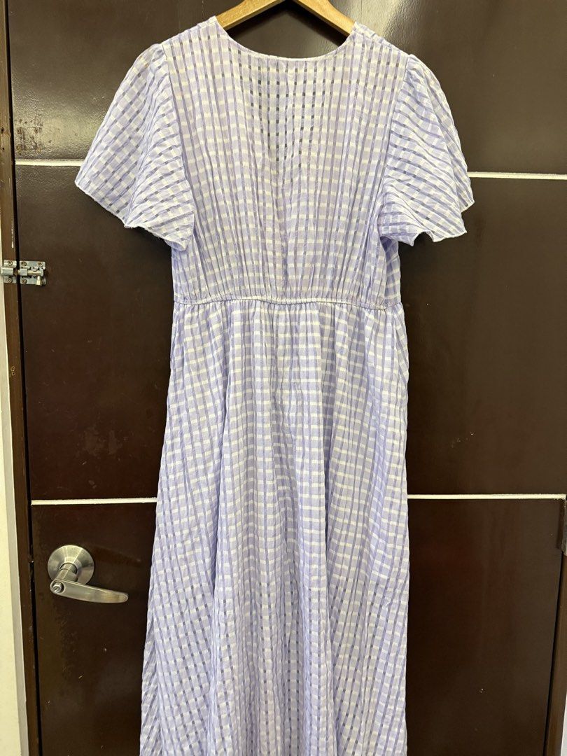 Purple Gingham Midi Dress with Flutter Sleeves (Category: Dresses) located in Bulacan. Submitted by emjay_17 (Listing ID 1461214547, Image 2). Description: - Adorable purple and white gingham midi dress - Flattering V-neckline - Cute flutter sleeves - Functional button details down the front - Comfortable elasticated waist - Ideal for casual outings and picnics.