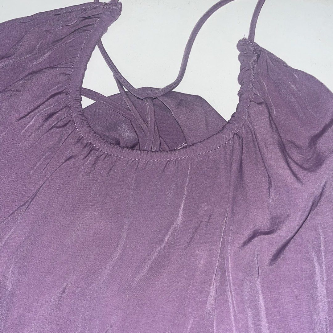Purple Ruffled Halter Neck Tank Top (Category: Sleeveless) located in Makati City. Submitted by midnightmelhem (Listing ID 1461140137, Image 3). Description: - Cute purple tank top - Halter neck with tie-back detail - Ruffled hemline - Lightweight and flowy material - Perfect for casual wear or layering.