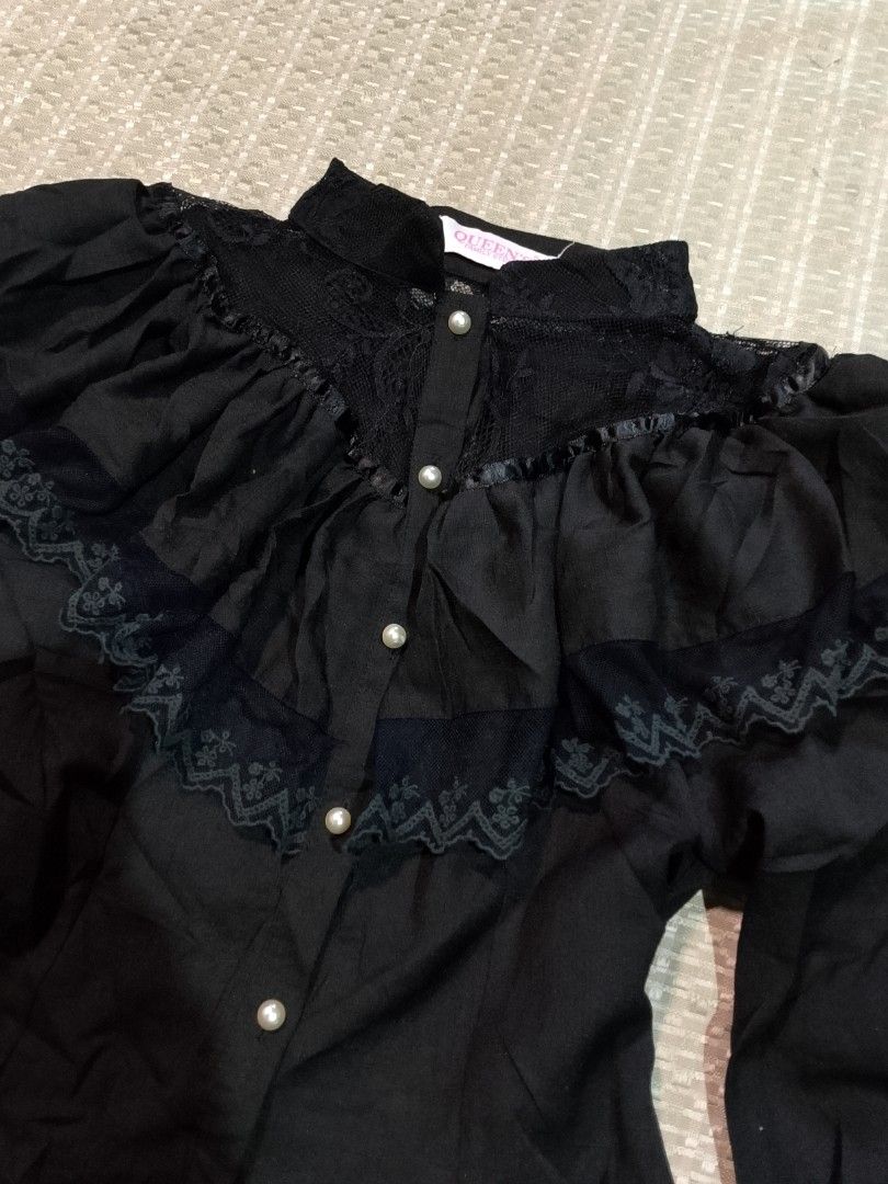 QUEENS Gothic Lolita top (Category: Longsleeves) located in Cebu City. Submitted by jny2k_thrifts (Listing ID 1461243820, Image 2). Description: black Victorian-style long-sleeve blouse featuring a ruffled collar and pearl-accented buttons..