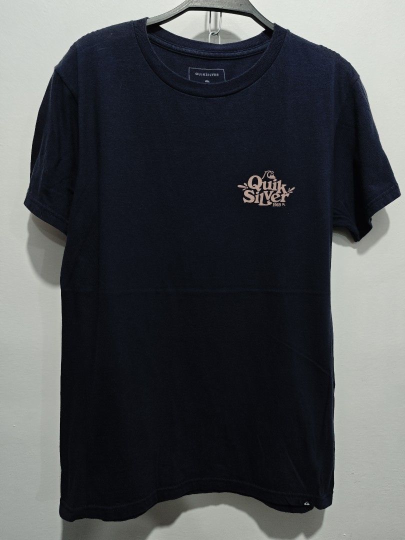 Quiksilver Navy Blue T (Category: Tshirts & Polo Shirts ) located in Bulacan. Submitted by pzj_thrift (Listing ID 1461164167, Image 1). Description: L 26 W 19 Condition 9/10 Color rate 9/10 No issue .