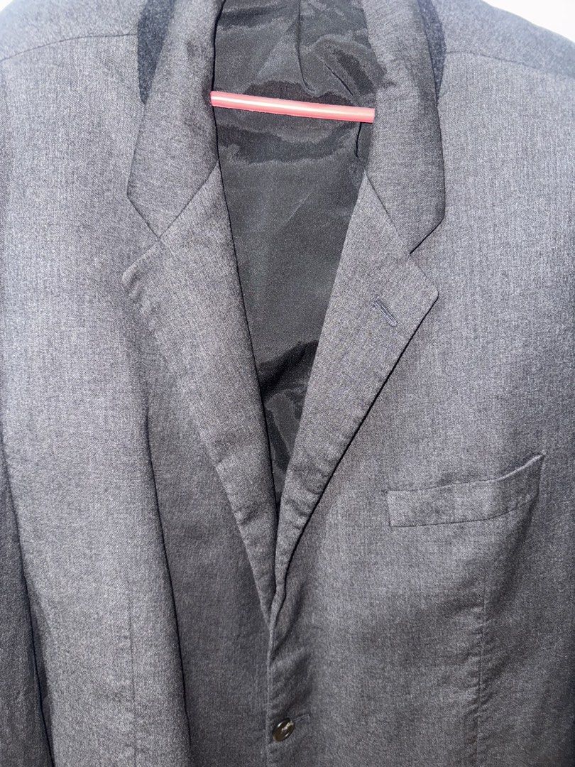 Ralph Lauren Men's Grey Blazer (Category: Coats, Jackets and Outerwear) located in Manila. Submitted by quintessesommerset (Listing ID 1461307219, Image 2). Description: - Brand: Lauren Ralph Lauren 23.5x28 - Material: Wool - Style: Classic single-breasted, two-button blazer - Pockets: Chest pocket, two front flap pockets - Interior: Fully lined - Occasion: Ideal for formal or smart casual wear.