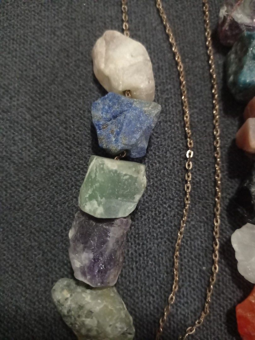 Raw Crystal Gemstone Necklace (Category: Necklaces) located in Paranaque City. Submitted by annhua17524 (Listing ID 1461250947, Image 2). Description: - Unique necklace featuring raw, uncut gemstones. - Mix of colorful stones: amethyst, lapis lazuli, fluorite, clear quartz, jasper, sun stone, Brazil citrine, black obsidian, rose quartz, amazonite, bloodstone, apatite, blue aventurine, labradorite, tourmaline, agate and pink opal - Approx. 1 inch 