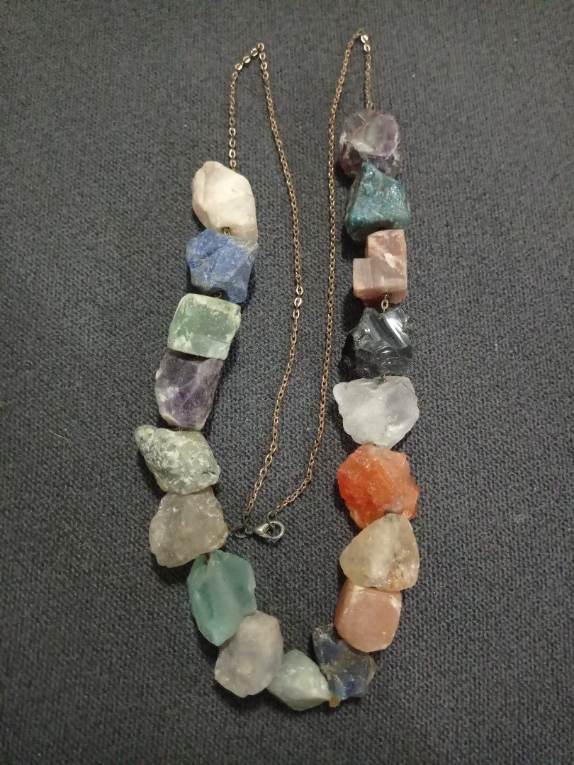 Raw Crystal Gemstone Necklace (Category: Necklaces) located in Paranaque City. Submitted by annhua17524 (Listing ID 1461250947, Image 1). Description: - Unique necklace featuring raw, uncut gemstones. - Mix of colorful stones: amethyst, lapis lazuli, fluorite, clear quartz, jasper, sun stone, Brazil citrine, black obsidian, rose quartz, amazonite, bloodstone, apatite, blue aventurine, labradorite, tourmaline, agate and pink opal - Approx. 1 inch 