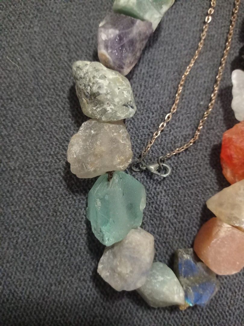 Raw Crystal Gemstone Necklace (Category: Necklaces) located in Paranaque City. Submitted by annhua17524 (Listing ID 1461250947, Image 3). Description: - Unique necklace featuring raw, uncut gemstones. - Mix of colorful stones: amethyst, lapis lazuli, fluorite, clear quartz, jasper, sun stone, Brazil citrine, black obsidian, rose quartz, amazonite, bloodstone, apatite, blue aventurine, labradorite, tourmaline, agate and pink opal - Approx. 1 inch 