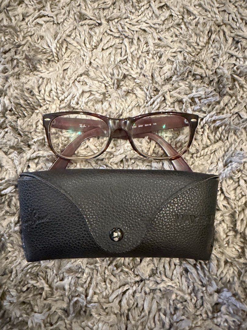 Ray-Ban Wayfarer Eyeglasses with Case (Category: Sunglasses & Eyewear) located in Pasig City. Submitted by CuratedProj (Listing ID 1461208872, Image 2). Description: - Authentic Ray-Ban Wayfarer eyeglasses - Stylish burgundy frame color - Comes with original Ray-Ban case - Frame size: 50-18-145 - Ideal for everyday wear - Feel free to ask any questions!.