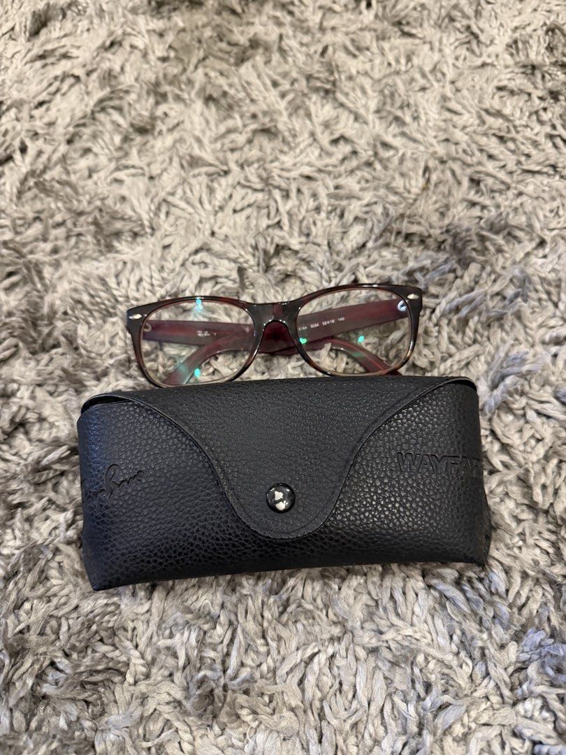 Ray-Ban Wayfarer Eyeglasses with Case (Category: Sunglasses & Eyewear) located in Pasig City. Submitted by CuratedProj (Listing ID 1461208872, Image 1). Description: - Authentic Ray-Ban Wayfarer eyeglasses - Stylish burgundy frame color - Comes with original Ray-Ban case - Frame size: 50-18-145 - Ideal for everyday wear - Feel free to ask any questions!.