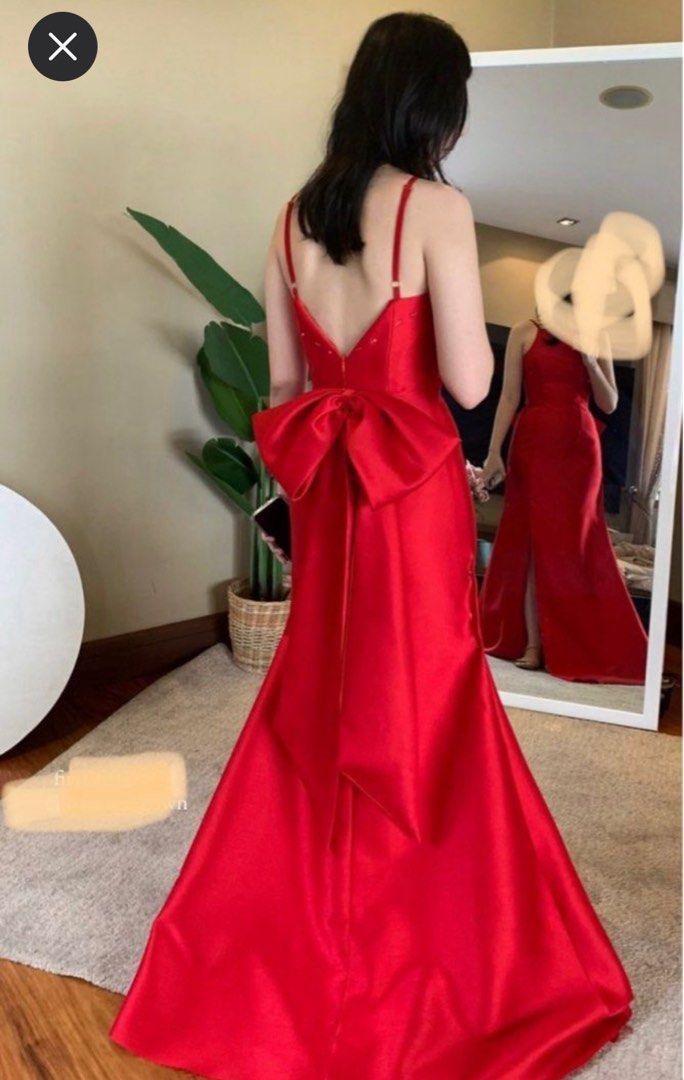 Red Formal Gown (Category: Evening dresses & gowns) located in Manila. Submitted by poshgirlph (Listing ID 1461287325, Image 1). Description: - Beautiful red mermaid gown from Luci - Striking bow detail at the back - High slit for a dramatic flair - V-neckline and spaghetti straps - Ideal for formal events, weddings, or galas.