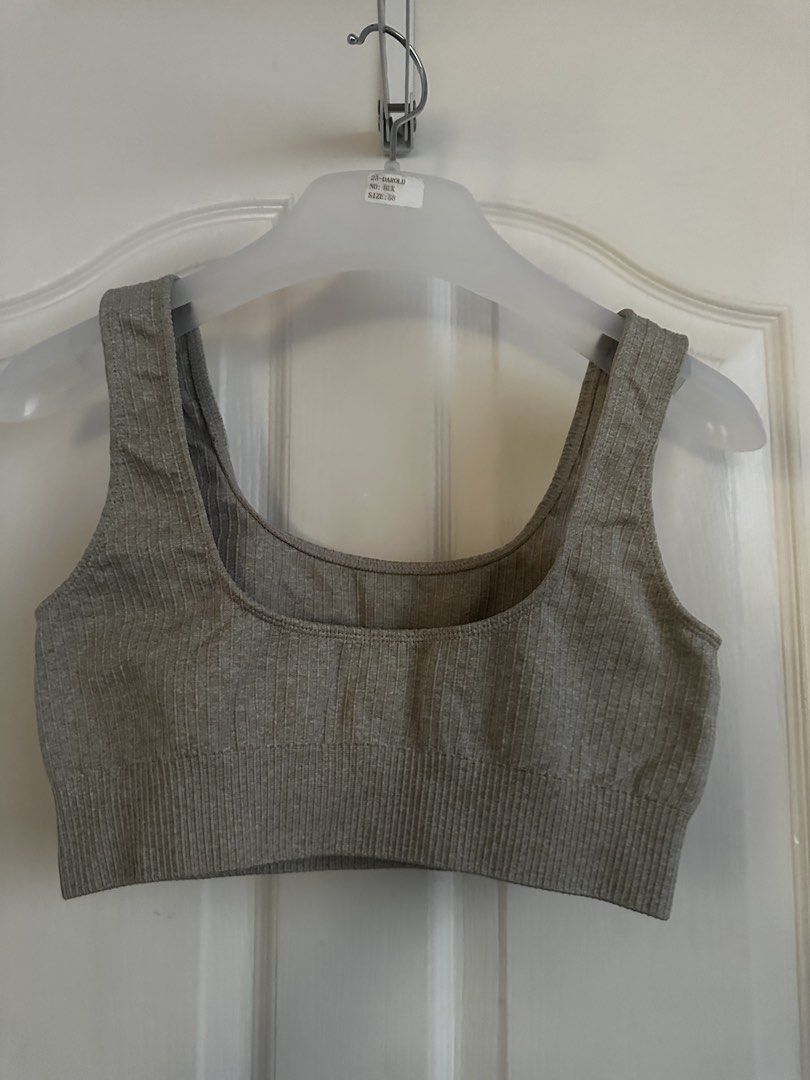 Ribbed Grey Sports Bra (Category: Activewear) located in Manila. Submitted by nfcloset_ (Listing ID 1461187157, Image 1). Description: - Grey ribbed sports bra - Comfortable and stretchy material - Flattering scoop neck design - Ideal for workouts, gym sessions, or casual wear - Versatile: pairs easily with leggings or shorts.