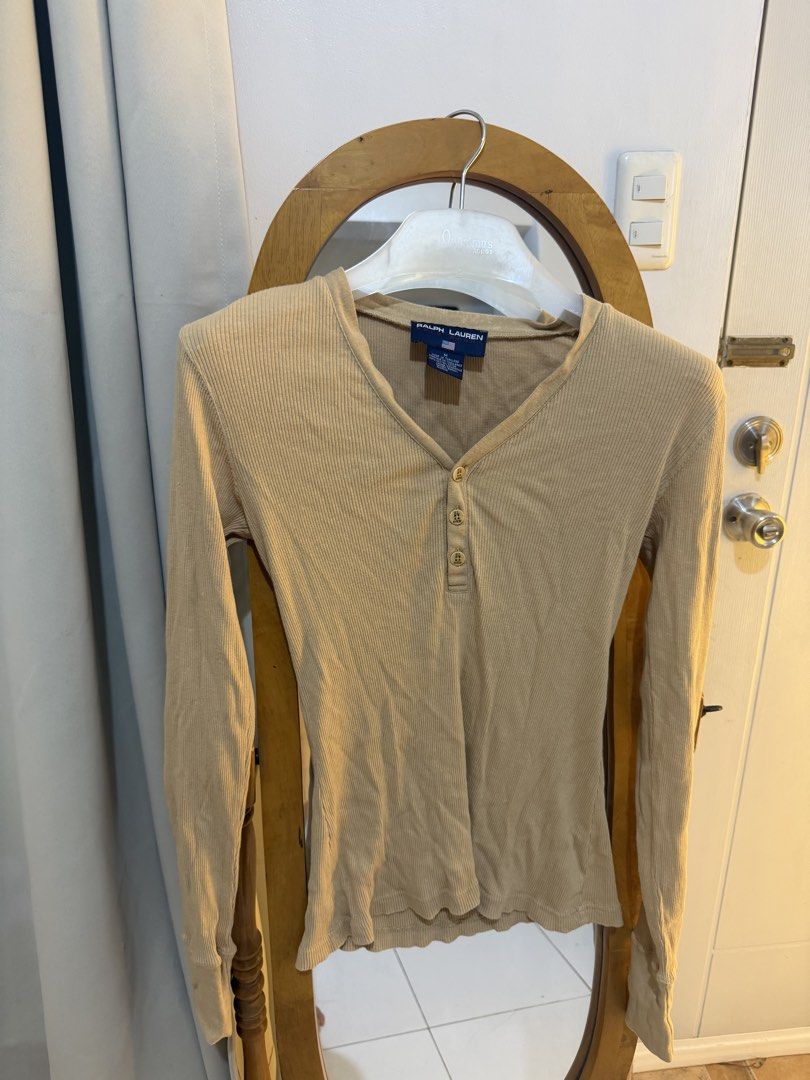 Ribbed Henley Long Sleeve Top (Category: Longsleeves) located in Mandaluyong City. Submitted by chocofudge__ (Listing ID 1461151300, Image 1). Description: - Classic beige ribbed long-sleeved top - Brand: Ralph Lauren - Features a Henley neckline with button details - Made from soft and stretchy material - Perfect for layering or wearing solo - Designed for a snug fit.
