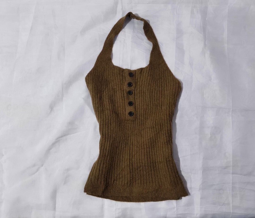 Ribbed Knit Halter Top with Decorative Buttons (Category: Sleeveless) located in Pulilan. Submitted by hly_cllctn (Listing ID 1461183742, Image 1). Description: Ribbed Knit Halter Top with Decorative Buttons ‎ ‎Small to Large (stretchable) ‎ ‎price: 120 pesos (au) ‎ ‎​Style: Ribbed Knit Halter Neck Top ‎​Color: Mocha / Warm Brown ‎​Details: Front button accent (decorative / non-functional buttons) ‎​Condition: Excellent, no issues.